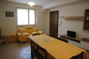 a living room with a table and a couch at Casa Dolce Casa in Vacri