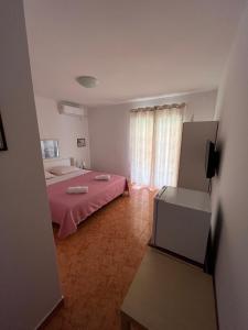 Postel nebo postele na pokoji v ubytování Apartments and Rooms Markovski
