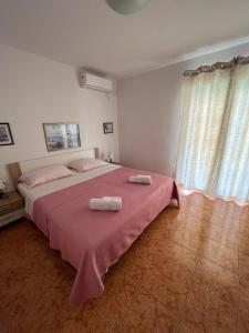 Postel nebo postele na pokoji v ubytování Apartments and Rooms Markovski