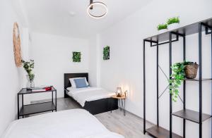 En eller flere senge i et værelse på Forest Premium Apartment Balcony - Mülheim, WI-FI, Netflix