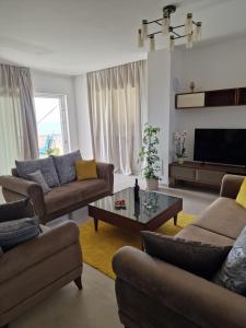 a living room with two couches and a coffee table at Luxury Apartment Moobl - Free parking in Dubrovnik