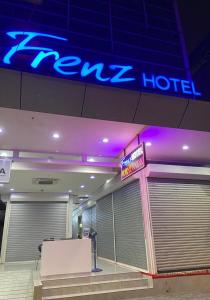 a hotel with a sign in front of a hotel at Frenz Hotel Kuala Lumpur in Kuala Lumpur