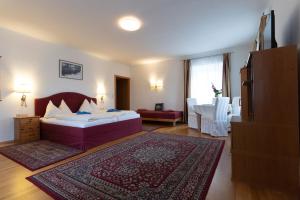 Postel nebo postele na pokoji v ubytování Hotel Pension Kandolf