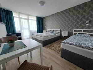 Postel nebo postele na pokoji v ubytování PartSide Balatonfüred