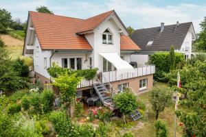 an aerial view of a house with an orange roof at im Oberdorf in Achern