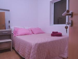 Postel nebo postele na pokoji v ubytování Casa de Nômades Digitais