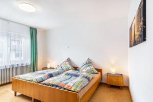 a bedroom with a bed and a window at Sonnenschein in Zell am Harmersbach