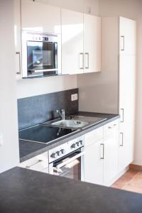 Kuchyň nebo kuchyňský kout v ubytování Ferienwohnung Sandstrand