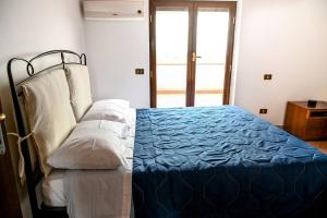 Ліжко або ліжка в номері Nel Verde, A Mezzora Dal Centro