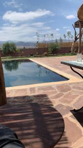 a swimming pool in the middle of a patio at Offrez-vous un moment de détente in Marrakesh