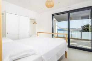 Ένα ή περισσότερα κρεβάτια σε δωμάτιο στο Justina Apartment