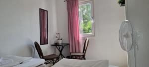 Postel nebo postele na pokoji v ubytování Guest House Tidaholm