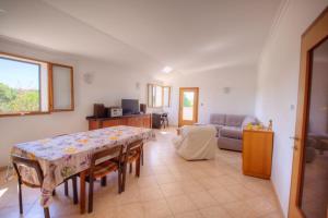 a living room with a table and a couch at Casa Cerin with Private Pool in Barat