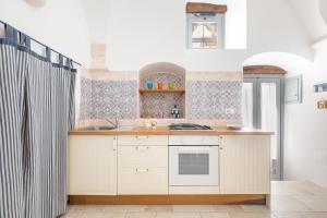 Photo de la galerie de l'établissement La Casetta Bianca by BarbarHouse, à Locorotondo