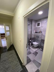 a bathroom with a shower and a toilet at Charming Flat with Garden Working Space EYUP2 in Istanbul