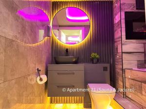 a bathroom with a sink and a mirror at Serenity Apartments Bradford in Bradford