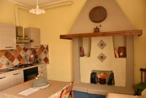 a kitchen with a table and a counter top at Terme e relax nella campagna viterbese in Viterbo