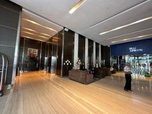 a person standing in a bowling alley in a mall at One Bukit Ceylon by Home Suites in Kuala Lumpur