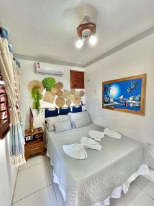 a bedroom with a bed in a room at Raio de Sol Residence in Canoa Quebrada