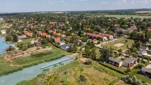 an aerial view of a small town next to a river at Balatonic apartman in Zamárdi