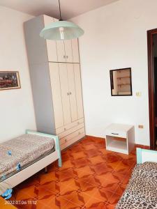 Ένα ή περισσότερα κρεβάτια σε δωμάτιο στο Room in Apartment - La Palma Etnik Room Sardinia