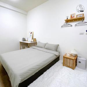 Giường trong phòng chung tại Xishi Stay