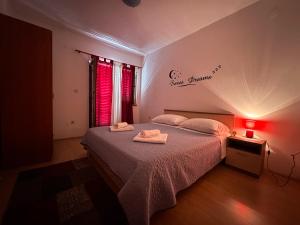 Postel nebo postele na pokoji v ubytování Apartment Lucija