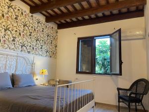 En eller flere senger på et rom på Casale Dell Ulivo - A cottage near the sea and mountains