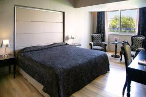 Postel nebo postele na pokoji v ubytování Cleopatra Hotel