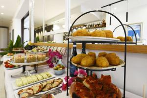 a buffet with several plates of food on display at Best Western Hotel Martello in Lampedusa
