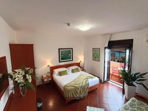 a hotel room with a bed and a balcony at Best Western Hotel Martello in Lampedusa
