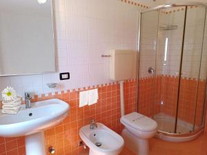 a bathroom with a sink and a toilet and a shower at Best Western Hotel Martello in Lampedusa