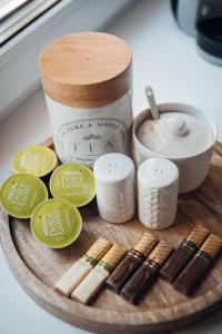 a wooden plate with chopsticks and a jar of soy sauce at Stylish and cozy old town apartment in Võru