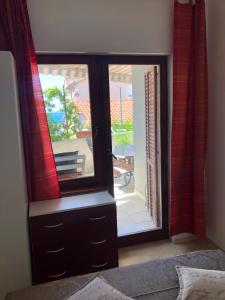 Posteľ alebo postele v izbe v ubytovaní Apartmani Gloria