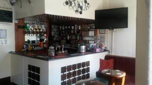 a bar in a restaurant with a television above it at Sharn Bek Hotel in Blackpool
