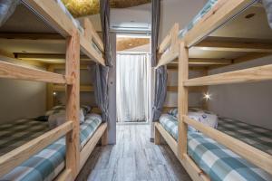 a bunk bed room with two bunk beds in it at Vila Maria Mix Dorm by HOST-POINT in Costa da Caparica