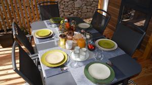 a table with plates of food on a patio at Lucas Mobile Home - premium mobile home with terrace and patio in Drage