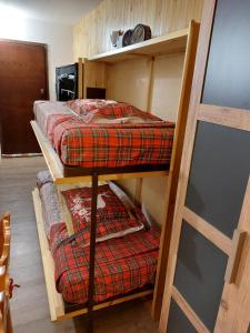 two bunk beds in a room with a ladder at Ciel Bleu - Cir 0122 in Pila