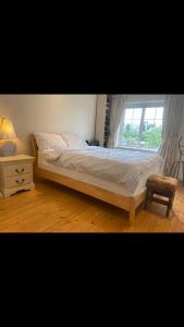 a bedroom with a bed and a window at The Piano House in Carlow