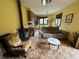 a living room with a couch and a table at casa carmiña in Ourense