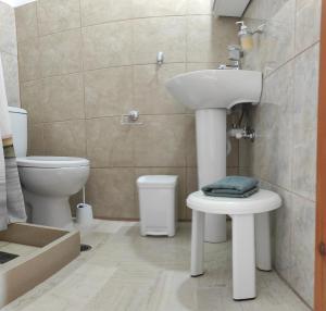 a bathroom with a sink and a toilet at Νέος Πύργος Studio in Neos Pirgos