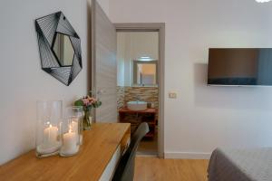 TV a/nebo společenská místnost v ubytování Bissenti Rooms - Eja Sardinia