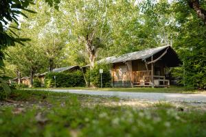 a log cabin in the middle of a forest at Glamping Tuscany in Capannole