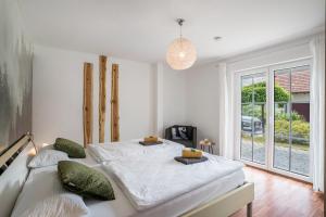 Postel nebo postele na pokoji v ubytování Ferienwohnung Hohfelsenblick