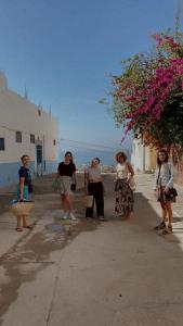 a group of women walking down a street at Green IGR Guesthouse in Agadir