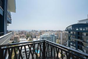 a balcony with a view of a city at Albimo Loft by Newinn in Mahmutlar