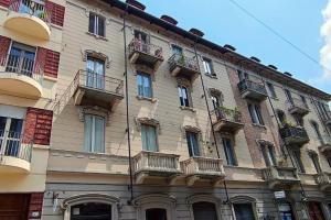 a large building with balconies on the side of it at Casa Relax - 500 mt. dal Centro in Turin