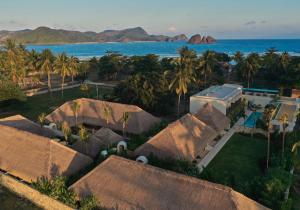 an aerial view of a house and the ocean at Boni Beach Lombok Boutique Hotel in Selong Belanak