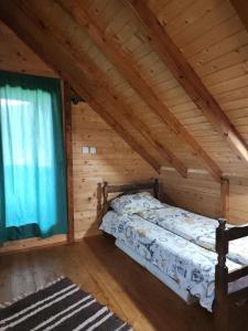 Postel nebo postele na pokoji v ubytování Planinska tišina Guest House