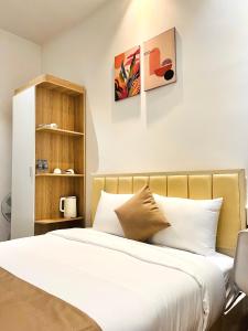 Postel nebo postele na pokoji v ubytování Torino Hotel Dalat